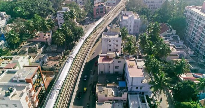 An aerial view of namma metro train moving on railroad track in bangalore,india, railway network