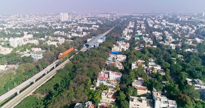 An aerial pan view of namma metro platform and railroad track under construction in bangalore,india