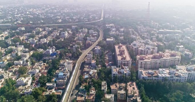 An aerial view of namma metro train moving on railroad track in bangalore,india, railway network