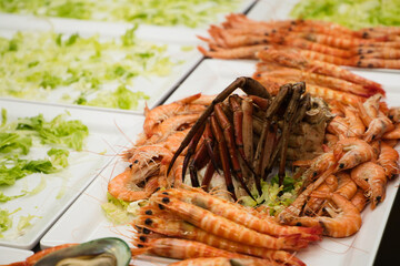 Seafood. Set of different seafood, shrimp, prawns, mussels, spider crab, lobster to serve in a catering. Celebration and event concept.