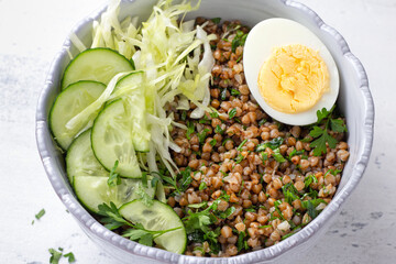 Nutritious Buckwheat Bowl with Fresh Cucumber, Cabbage, and Egg