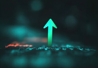 Bright teal arrow pointing up against dark background