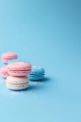 Obraz premium paris macarons sprinkles turquoise background pink