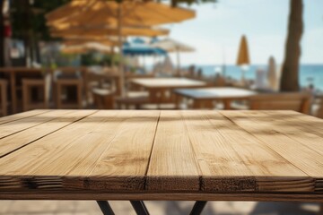 Empty wooden table outdoors, beach cafe blurred background