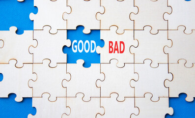 Fototapeta premium Good or Bad symbol. Concept word Good or Bad on wooden puzzle. Beautiful blue background. Business and Good or Bad concept. Copy space