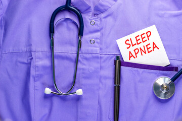 Sleep apnea symbol. Concept words Sleep apnea on beautiful white card. Stethoscope and pen....