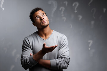 young man thinking and having questions