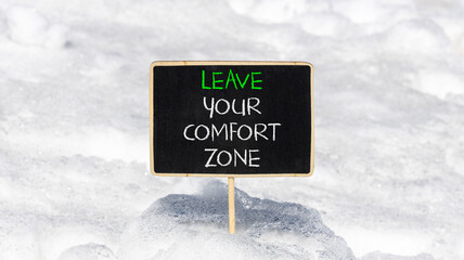 Leave your comfort zone symbol. Concept words Leave your comfort zone on beautiful black blackboard. Beautiful white snow background. Business psychological Leave your comfort zone concept. Copy space