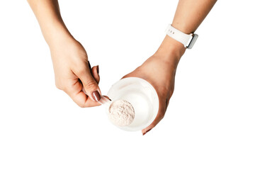 Woman's hands with measuring spoon puts portion of whey protein powder into a shaker, making protein drink cocktail, isolated on transparent background, top view