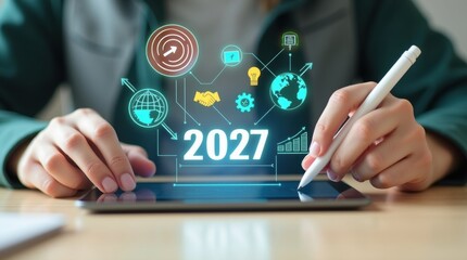 A person using a tablet with a projected 2027 business plan.
