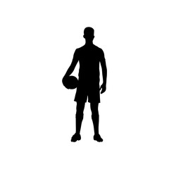 A football player is standing with a football in his hand silhouette .