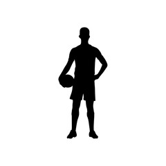 A football player is standing with a football in his hand silhouette .