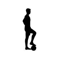 A football player is standing with his feet on the football silhouette.
