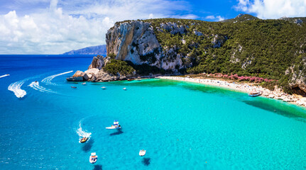Best and most beautiful beaches of Sardegna island (Italy) - Cala Luna in gulf of Orosei a spectacular national park, Aerial panoramic drone view of white sandy beaches and turquoise sea
