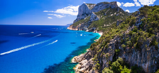Best and most beautiful beaches of Sardegna island (Italy) - impressive Cala Sisine in gulf of Orosei . Aerial panoramic drone view of white sandy beach and turquoise sea.