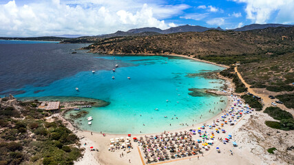 Sardegna (Sardinia) Italy. Best scenic beach in Villasimius. Beautiful Punta Molentis with turquoise trasparent sea , white beach and rocks. Aerial drone panoramic view.