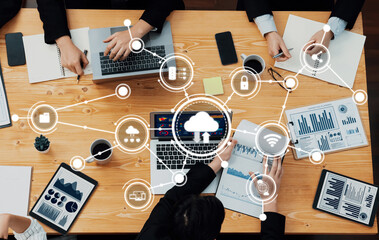 Naklejka na ściany i meble Engaging scene of a collaborative computing meeting where participants utilize laptops and data visuals to enhance teamwork and decision-making. Amity