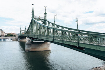 The stunning Liberty Bridge in Budapest gracefully spans the beautiful Danube River