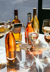 Different types of wine in glasses - red, white, rose and amber. Wine tasting in a bar or restaurant.