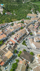 Stunning aerial view of Zahara de la Sierra, Spain, with white houses and mountain landscape