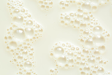 Macro milk surface close-up,Macro milk texture,White surface of milk and bubbles and ripples from above birds eye view