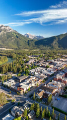 Stunning aerial view of Banff and surrounding valley in summer sunlight