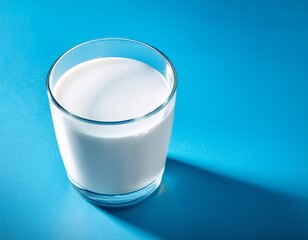 glass of fresh milk on blue background with copy space dairy free healthy lifestyle concept dairy products protein organic drinks advertising and healthy lifestyle branding