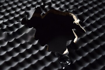 Sound dampening wall layers exposed to reveal inner structure details Generative AI