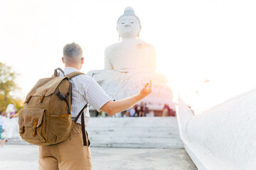 Traveler visiting magnificent white buddha statue in Phuket, Thailand