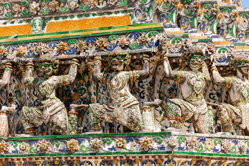 Intricate detail of ornamented yakshas at wat arun temple in Bangkok