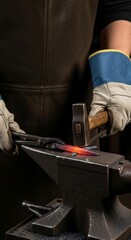 Obraz premium Focused blacksmith shaping heated metal on an anvil in a traditional forge, showcasing craftsmanship, strength, and timeless artisanal skill