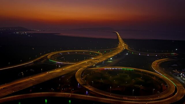 India's longest sea bridge: Trans-Harbour Sea Link. Atal Setu sea bridge in Mumbai, Maharashtra, India. Time-lapse of a city at night with bright skyscrapers and a dense network of glowing buildings.