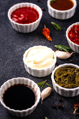 Set of different sauces. Ketchup, mustard, pesto