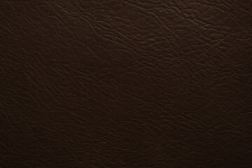 Fototapeta premium A close-up of textured brown leather conveys a sense of durability and elegance, ideal for design projects requiring a sophisticated touch or a warm, inviting atmosphere.