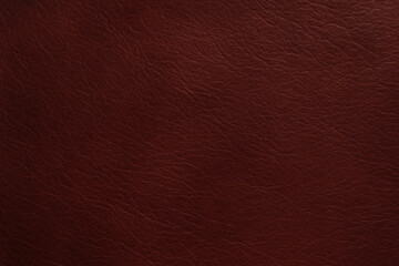 Fototapeta premium A rich, textured background featuring deep reddish-brown leather. Ideal for creating stylish designs, branding projects, and artistic endeavors that require a touch of luxury.