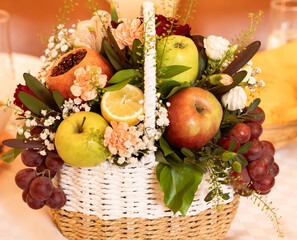basket with fruits and flowers
