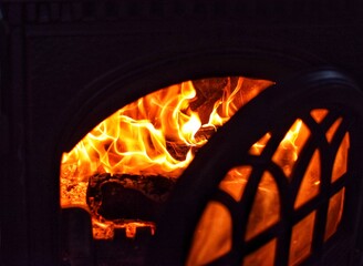 fire in the fireplace with the door open
