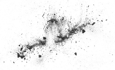 Particles of charcoal on a white background, top view. Black charcoal pieces and dust.