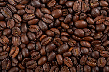 Aroma coffee beans as background, top view. Roasted beans texture.