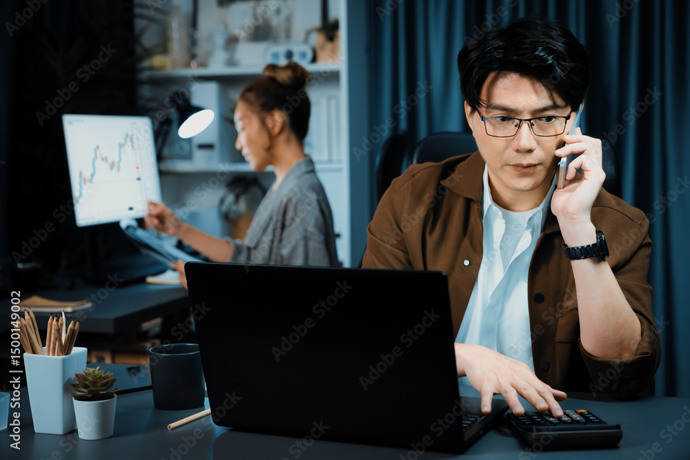 Poster businessman looking on laptop while calling to broker with calculating value margin of profit for th