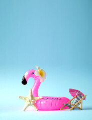 Pink inflatable flamingo with flower and starfish. Summer pool float party idea. Summer concept.