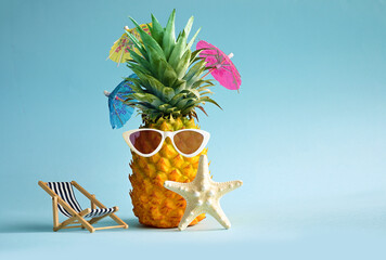 Starfish and pineapple in sunglasses. Summer pool float party idea. Summer concept.