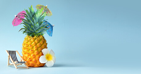 White flower, chair and pineapple. Summer pool float party idea. Summer concept.
