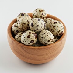 Obraz premium Quail eggs in bowl, close up view on white background
