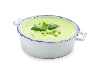 Tasty pea cream soup with basil isolated on white