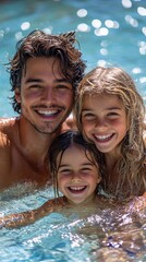 Happy family of three enjoys a refreshing swim in a pool.  Smiling faces emerge from the water