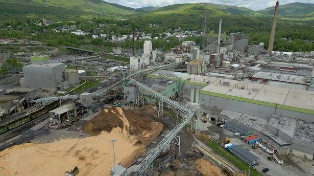 Aerial View of Industrial Paper Mill and Wood Processing Plant in Maine, drone 4k