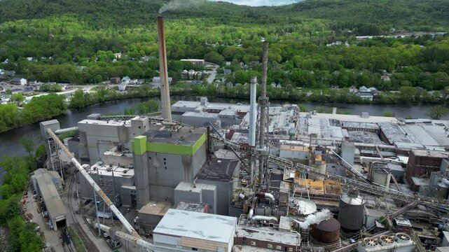 Aerial View of Industrial Paper Mill and Wood Processing Plant in Maine, drone 4k