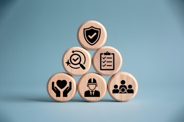 Work Safety and Compliance Concept – Wooden Blocks with Icons Representing Health, Training, Inspection, and Risk Management