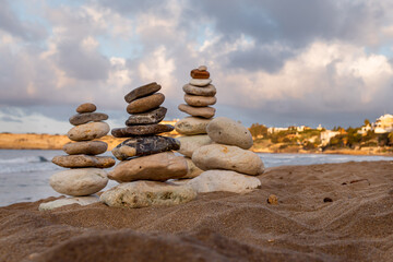 Balance stones stack tower close-up on Mediterranean sea background. Republic of Cyprus island...